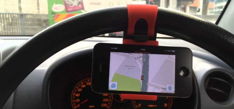 Steering wheel phone holder